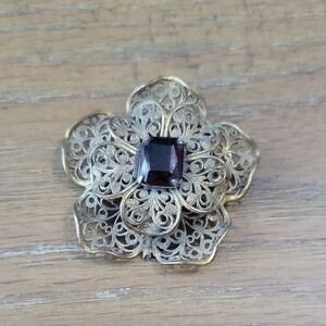 Elegant Gold tone Filigree Flower Brooch with Purple Gemstone